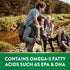 A family of four with two children hikes outdoors by a stream. Text: Contains Omega-3 Fatty Acids such as EPA & DHA.
