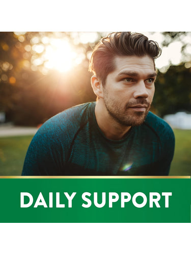 A man in athletic wear rests outdoors at sunset beside a banner graphic that states 'DAILY SUPPORT'.