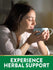 Young woman with eyes closed enjoys aromatic herbal drink from a mug, highlighting wellness benefits.