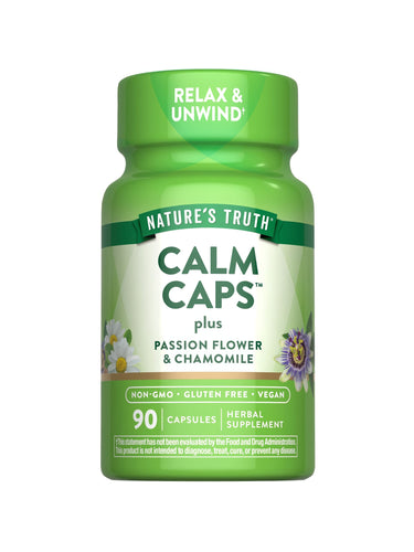 Nature's Truth Calm Caps, 90 capsules shown on a hand scale, highlighting the bulk size and quantity of the product package.