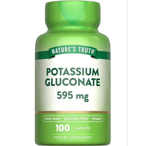 A bulk 100-count bottle of 595 mg Potassium Gluconate caplets displayed on a hand scale.