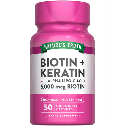 Hand holding a bottle of Biotin + Keratin with ALA Quick Release Capsules, 5,000 mcg Biotin, 50 count.