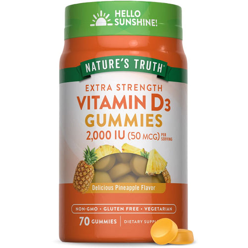 A hand holding two round, yellow Vitamin D3 gummies, each providing 2,000 IU (50 mcg).