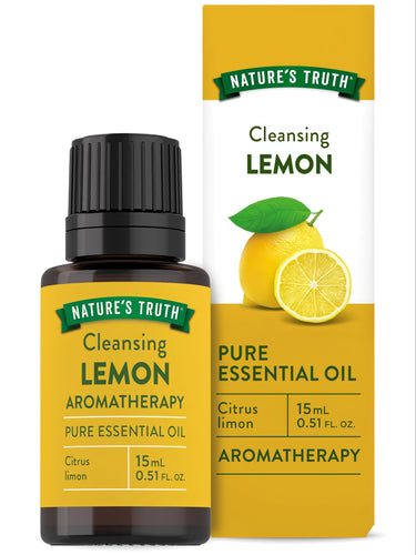 Hand holding Nature's Truth Cleansing Lemon Pure Essential Oil, 15mL or 0.51 FL. OZ., showcasing its size and packaging.
