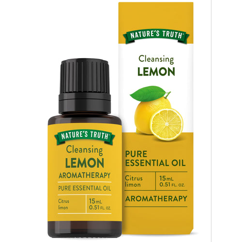 Hand holding Nature's Truth Cleansing Lemon Pure Essential Oil, 15mL or 0.51 FL. OZ., showcasing its size and packaging.