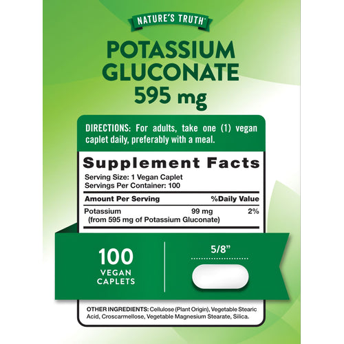 A hand holding a vegan caplet measuring 5/8 inches on a bulk scale, illustrating size and dosage details for supplements.