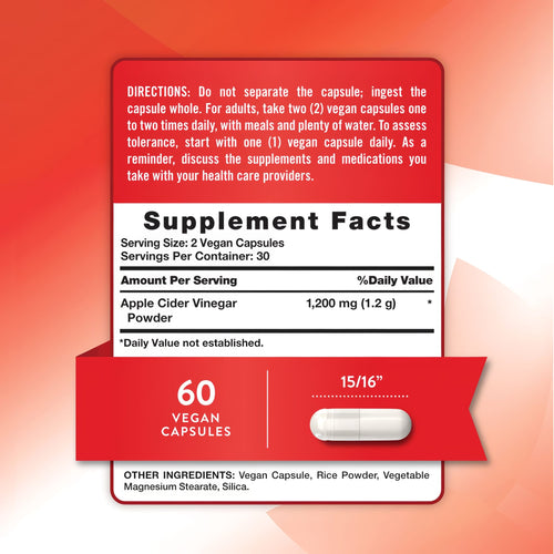 A vegan capsule measuring 15/16 inches is shown on a hand scale for bulk measurement purposes.