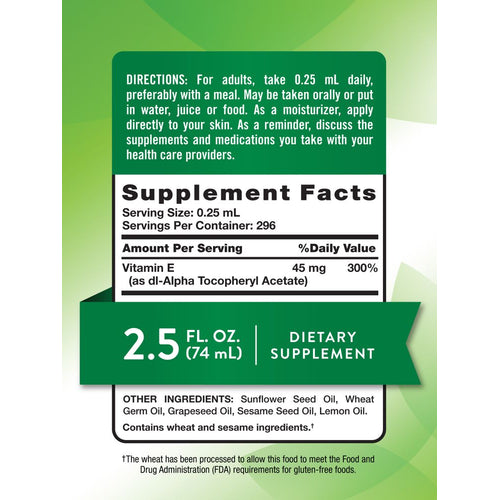 NT Vitamin E Oil Liquid, 2.5 FL. OZ. (74 mL) dietary supplement bottle on a hand scale, conveys bulk product size.