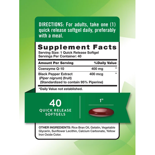A single dark red quick release softgel, measuring one inch in length, held on a hand scale.