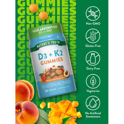 An assortment of orange, round D3 + K2 gummies, 50 count, with a delightful peach mango flavor is shown on a hand scale.