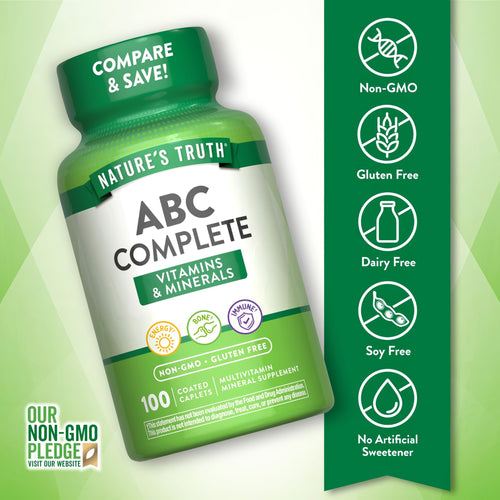 Bottle of Nature's Truth ABC Complete with 100 coated caplets being balanced on a hand scale.