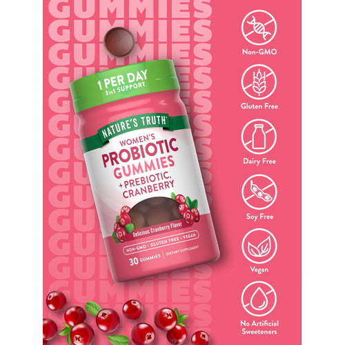 A single brown Women's Probiotic gummy shown on a hand, round in shape, indicating size for reference.