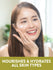 Young woman applying NT JW Vitamin E-Cream to cheek. Graphic text reads: Nourishes and hydrates all skin types.