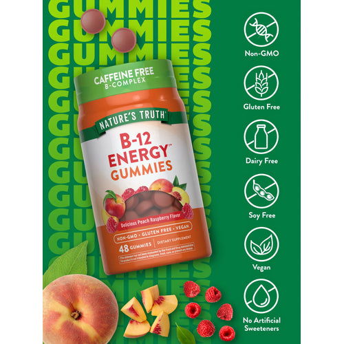 48 B-12 Energy Gummies in peach raspberry flavor, scattered with fresh fruit around the product bottle.