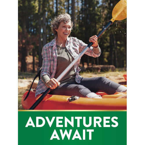 Middle-aged woman smiles while kayaking on a forest lake, holding a paddle. Text: ADVENTURES AWAIT.