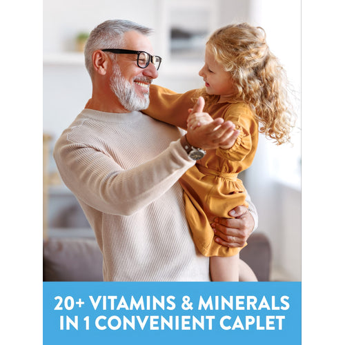 Smiling grey-haired man with glasses dancing with a young girl. Text at bottom: 20+ VITAMINS & MINERALS IN 1 CONVENIENT CAPLET.