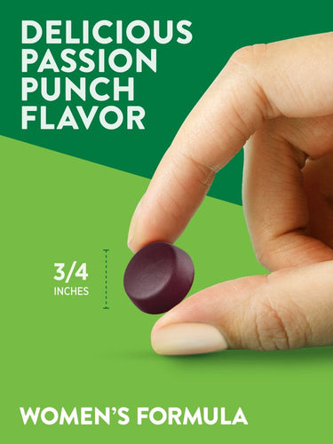 A hand holding a 3/4 inch gummy of the Women's Formula Passion Punch Flavor.