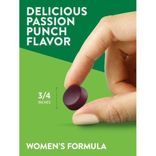 A hand holding a 3/4 inch gummy of the Women's Formula Passion Punch Flavor.