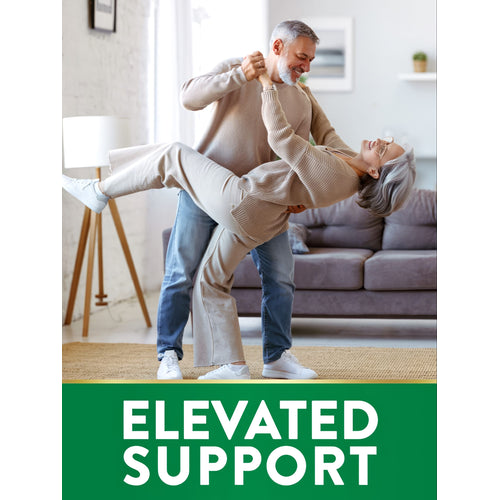 An older couple dances joyfully, with the man lifting the woman, alongside a Niacin supplement.