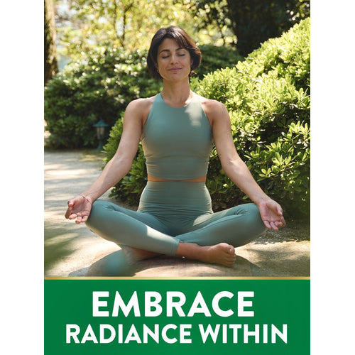 An adult woman with short dark hair meditates in a green sports outfit, sitting in a garden with lush greenery.