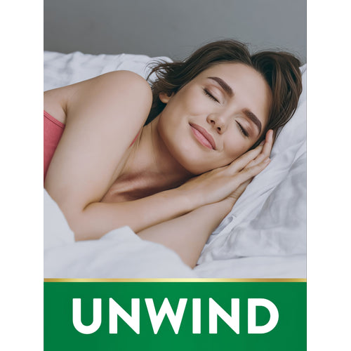 Young adult woman sleeping peacefully with a green banner and white text reading 'UNWIND' at the bottom.