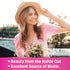 Young woman in hat holds flowers and smiles outdoors. Text: 'Beauty from the Inside Out,' 'Excellent Source of Biotin'.