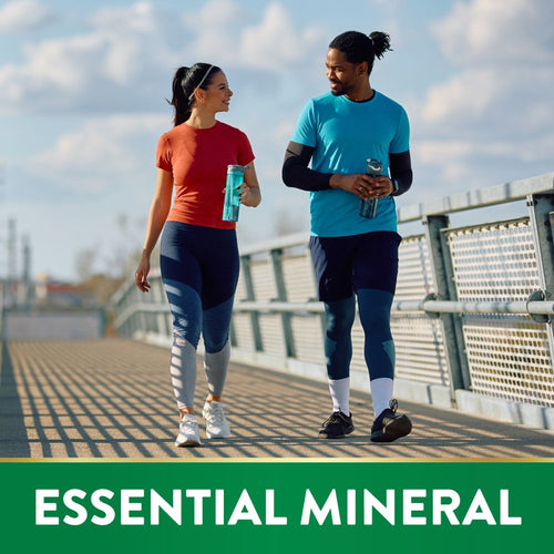 Young adult woman and man walk on a bridge, holding water bottles, next to text 'ESSENTIAL MINERAL'.