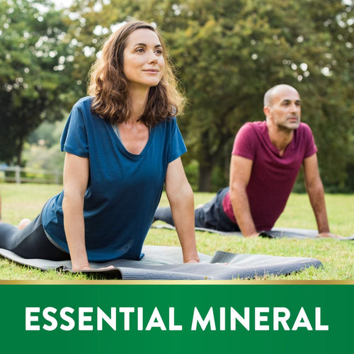 Man and woman practicing yoga in a park; text reads 'ESSENTIAL MINERAL'.