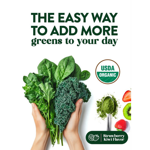 Hands hold spinach and kale next to a spoonful of NT Greens Powder in Strawberry Kiwi flavor.