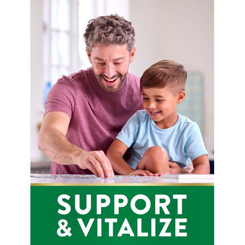 A smiling middle-aged man and young boy enjoy solving a puzzle together at a table with 'SUPPORT & VITALIZE' text.
