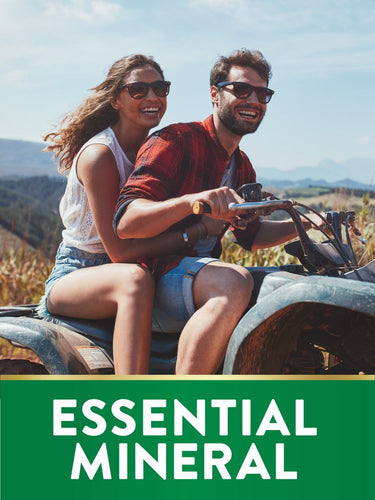 Young man and woman smile on an ATV with Magnesium Glycinate.