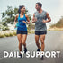 A man and woman jogging on a road, smiling and carrying water bottles. Text: DAILY SUPPORT.