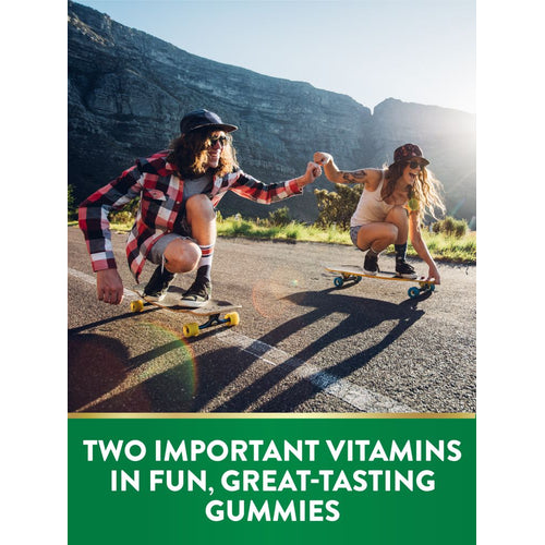 Two young adults skateboarding outdoors, giving a fist bump. Text: 'TWO IMPORTANT VITAMINS IN FUN, GREAT-TASTING GUMMIES.'