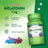 Two round, speckled 1 mg melatonin chewable tablets on a hand scale.