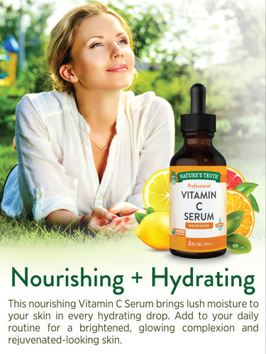 An adult woman lies on the grass, looking upwards, next to a Vitamin C Serum bottle.