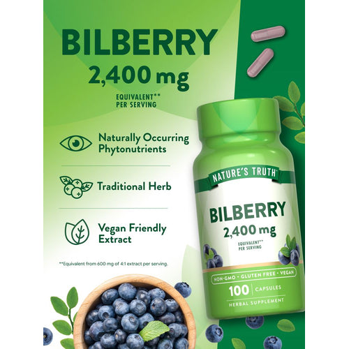 A hand holding two pink Bilberry 2,400 mg capsules on a scale.
