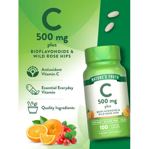 A hand holds a small scale displaying two 500 mg coated caplets.