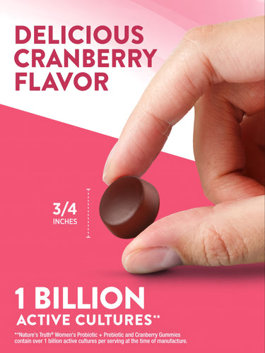 A round cranberry-flavored gummy measuring 3/4 inch in diameter rests on a hand scale for bulk measurement.