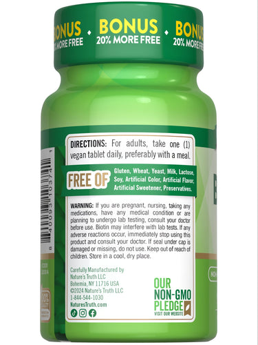 A hand holding a bulk scale container of 1000 mcg biotin vegan tablets.