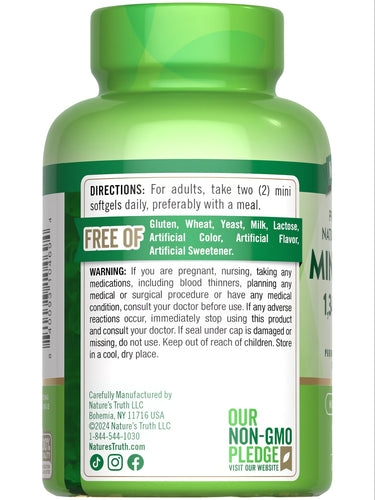 A hand holding Mini Fish Oil 1340 mg softgels, showcasing supplement size and packaging details for user reference.