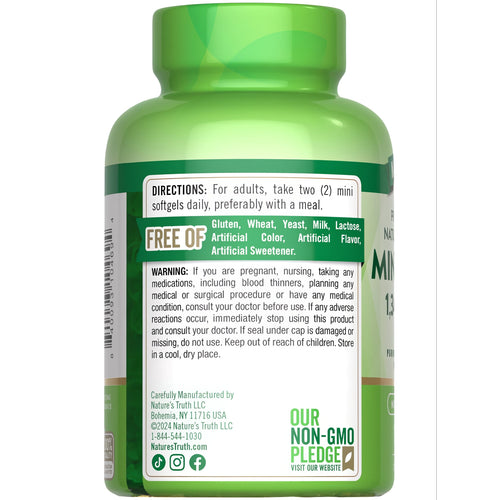 A hand holding Mini Fish Oil 1340 mg softgels, showcasing supplement size and packaging details for user reference.