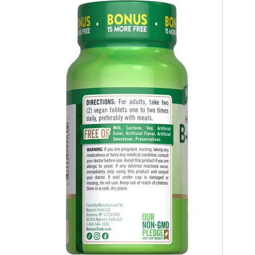 NT B-Complex + B-12 vegan tablets, 150+15 count, with 'BONUS 15 MORE FREE' printed on the label, displayed on a scale.