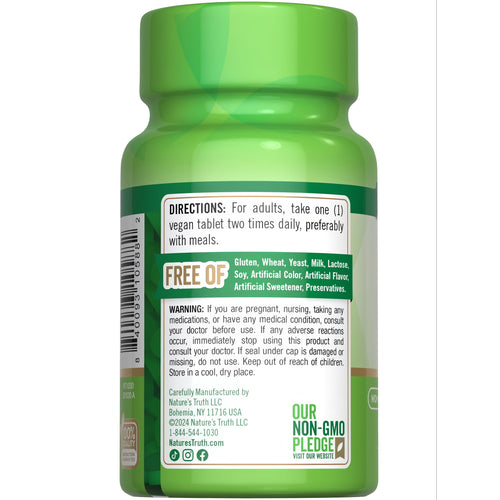 Hand holding a vegan NT B-1 100 mg (Thiamin) tablet.