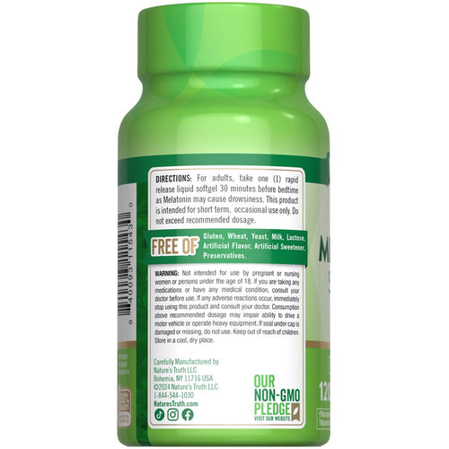 A hand holding a rapid release liquid softgel, showcasing size in a bulk scale setting.