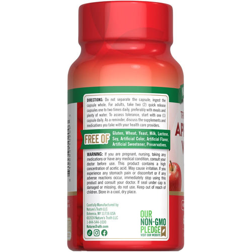 A hand holds a bottle of Apple Cider Vinegar 1200 mg capsules.