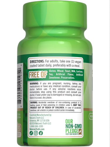 Hand holding a NT Iron 45 mg Slow Release vegan coated tablet.
