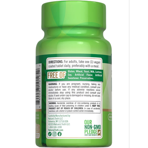 Hand holding a NT Iron 45 mg Slow Release vegan coated tablet.