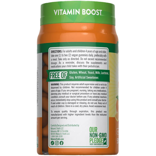 Vitamin Boost vegan gummies in a hand, showing count of one to two pieces.