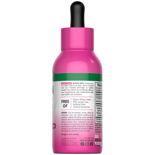 Hand holding NT Collagen Biotin Hyal Liquid 2 fl oz bottle.