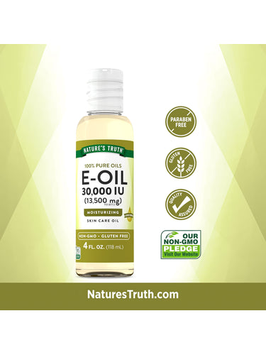 E Oil bottle with icons indicating it is Paraben Free, Gluten Free, Quality Assured, and Non-GMO for dietary attributes.